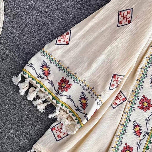 Jenna Tasseled Cape In Beige